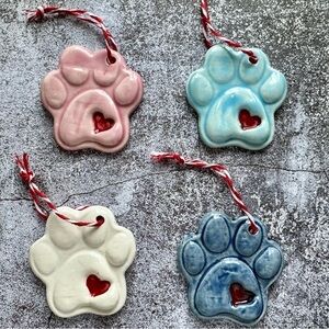 Handmade set of four Ceramic Paw Print Ornaments with Heart
